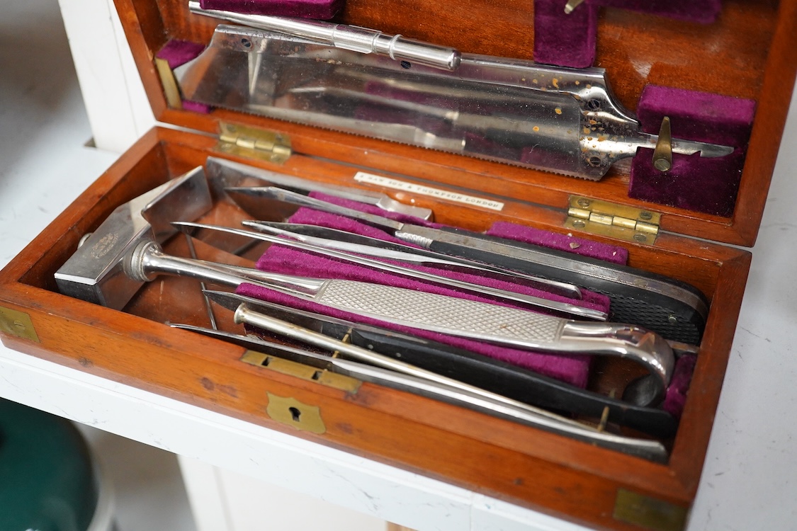 A 19th century mahogany cased surgeon’s set of steel surgical instruments by S. Maw Son & Thompson, London, comprising of an amputation saw, scalpel, a hammer, etc., dimensions of the case; 23.5cm wide, 10.5cm deep, 4cm